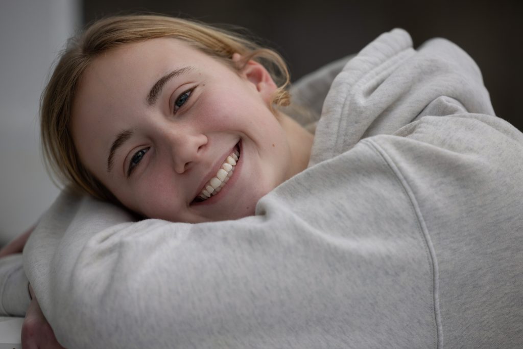 A smiling patient wearing braces